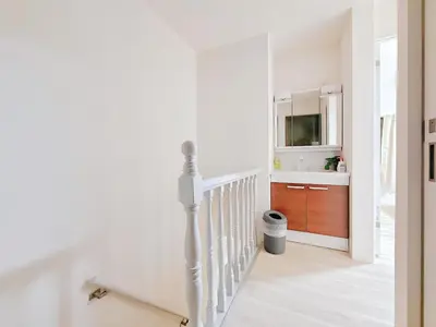 a white staircase with a sink and a mirror at Mori Hosue \u8d64\u7fbd\u5357 in Tokyo