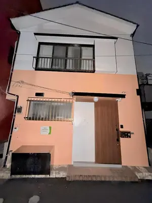 a small house with a door and a window at Mori Hosue \u8d64\u7fbd\u5357 in Tokyo