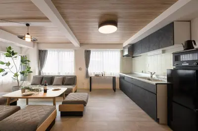 a kitchen and a living room with a table at Shinjuku 6-chome City Stay 4F \u65b0\u5bbf6\u4e01\u76ee \u30b7\u30c6\u30a3\u30b9\u30c6\u30a4 4F in Tokyo