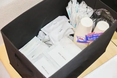 a black box filled with toilet paper and other items at \u82e5\u8449\u30db\u30c6\u30eb in Tokyo
