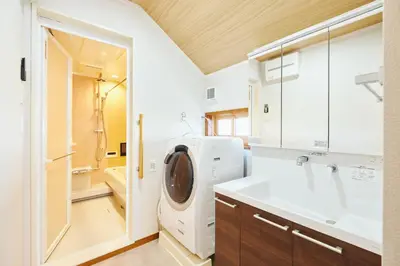 a laundry room with a washer and dryer in it at \u82e5\u8449\u30db\u30c6\u30eb in Tokyo