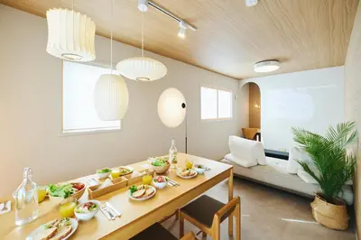 a dining room with a table with food on it at \u82e5\u8449\u30db\u30c6\u30eb in Tokyo