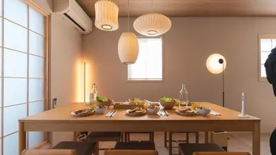 a dining room with a table with food on it at \u82e5\u8449\u30db\u30c6\u30eb in Tokyo