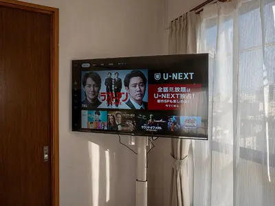 a flat screen tv hanging on a wall at \u685c\u306e\u5ddd79 \u5317\u5343\u4f4f\u5bb6\u5ead\u516c\u5bd36-8\u4eba\u4e28Kita Senju family apartments for 6-8 people in Tokyo