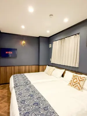 a bedroom with a large bed and a window at tsukiji 2min,V101,Ginza 10min in Tokyo