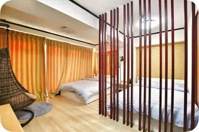 a bedroom with orange curtains and a bed in it at Alice Room\u677f\u6a4b501 in Tokyo