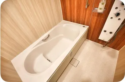 a white bath tub in a small bathroom at Alice Room\u677f\u6a4b501 in Tokyo