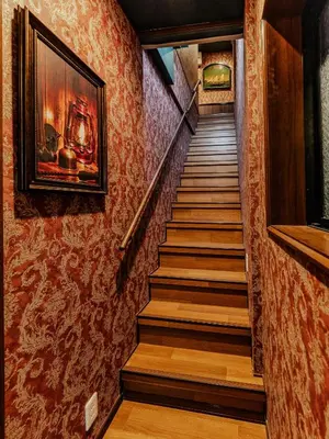 a staircase in a house with red wallpaper at tsukiji 2min,V201,Ginza 10min in Tokyo