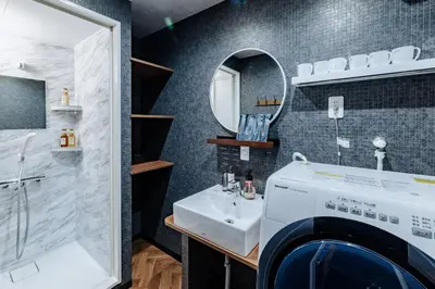 a bathroom with a washing machine and a sink at tsukiji 2min,V301,Ginza 10min in Tokyo