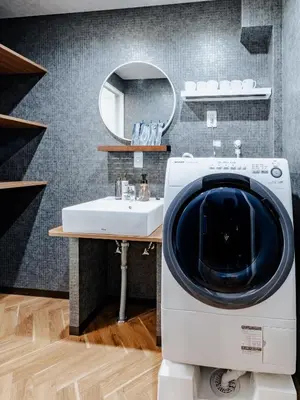 a washing machine in a bathroom with a sink at tsukiji 2min,V301,Ginza 10min in Tokyo