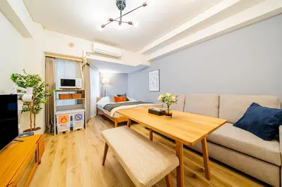 a living room with a couch and a table at Lions Mansion SHIBUYA 219 in Tokyo
