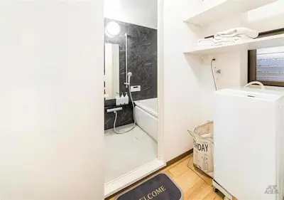 a small bathroom with a tub and a sink at 8min to Keisei Hikifune Entire House Sleeps12 in Tokyo