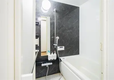 a bathroom with a shower and a mirror at 8min to Keisei Hikifune Entire House Sleeps12 in Tokyo