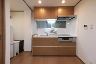 a kitchen with a sink and a stove top oven at ever Inn Higashi koenji in Tokyo