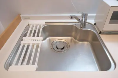 a sink with a faucet in a kitchen at ever Inn Higashi koenji in Tokyo
