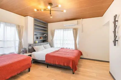 a bedroom with two beds and a window at HanaStay-Tokyo Ueno 2 Stops in Tokyo