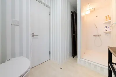 a bathroom with a toilet and a shower at Vacation Stay Koiwa in Tokyo