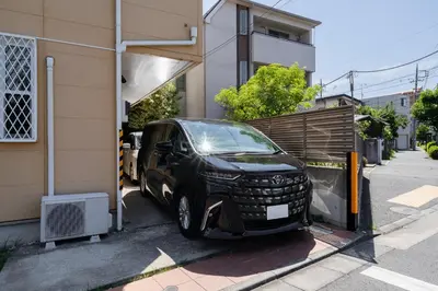 a car is parked outside of a house at Vacation Stay Koiwa in Tokyo