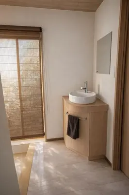 a bathroom with a sink and a window at Kukunochi in Tokyo