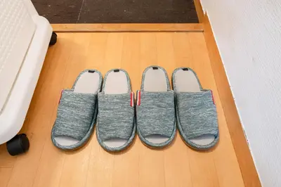 four pairs of slippers on the floor of a room at Shinjuku,Higashi Shinjuku Sta, 5min walk,WiFi in Tokyo