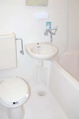 a white bathroom with a toilet and a sink at SunRiseStay Shibuya\u6da9\u8c37 in Tokyo