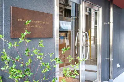 a sign on the side of a building at Premium Apartment Hotel Tokyo Shinjuku in Tokyo