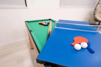 a ping pong table with a ball on it at HOTEL Edogawa in Tokyo