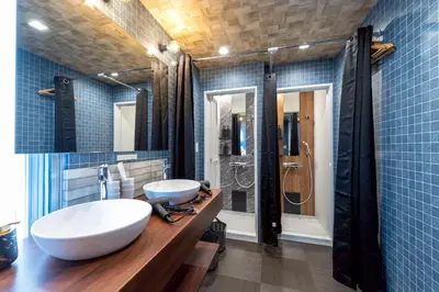 a bathroom with two sinks and a shower at 3 min walk from Sangenjaya Sta, 90square meters, Bouldering in Tokyo