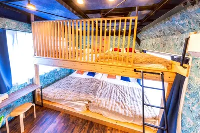 a bedroom with a bunk bed in a house at 3 min walk from Sangenjaya Sta, 90square meters, Bouldering in Tokyo