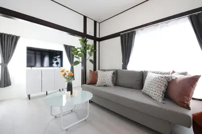 a living room with a couch and a table at \u56db\u3064\u6728\u6238\u5efa2165 in Tokyo