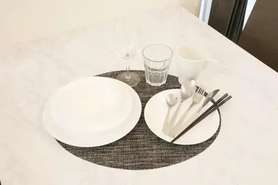 a table with two white plates and glasses on it at \u56db\u3064\u6728\u6238\u5efa2165 in Tokyo