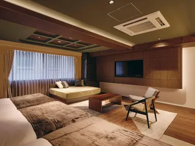 a hotel room with two beds and a tv at illi Eme Tokyo-Toranomon in Tokyo