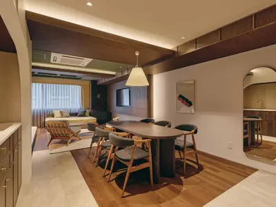 a kitchen and living room with a table and chairs at illi Eme Tokyo-Toranomon in Tokyo