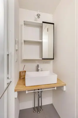 a bathroom with a white sink and a mirror at mtk\u6238\u8d8a3\u4e01\u76ee01 in Tokyo