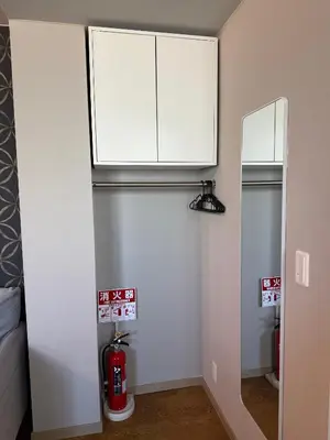 a room with a fire hydrant and a white wall at The Asakusa Townhouse in Tokyo