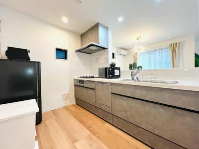 a large kitchen with a sink and a refrigerator at Lulu House 3BDR Room! Near Skytree in Tokyo