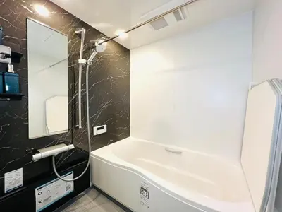 a bathroom with a white tub and a mirror at Lulu House 3BDR Room! Near Skytree in Tokyo