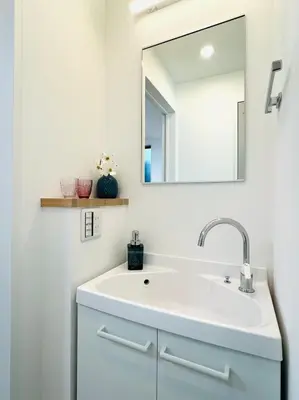a bathroom with a sink and a mirror at Lulu House 3BDR Room! Near Skytree in Tokyo