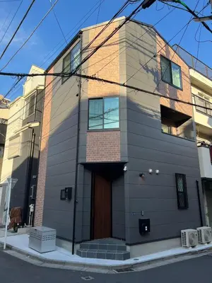 a tall building with a door on a street at Lulu House 3BDR Room! Near Skytree in Tokyo