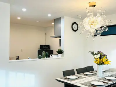 a kitchen with a dining table and a chandelier at Lulu House 3BDR Room! Near Skytree in Tokyo