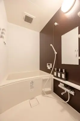 a bathroom with a shower and a sink at Y's Hotel in Tokyo
