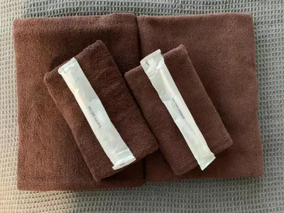 two brown towels sitting on top of a table at Tokyo Ikebukuro House in Tokyo