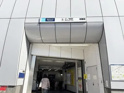 a person walking through a hallway of a building at 3-mins walk from Hibiya Line station in the Ueno area of Taito city, 2-bed private rental, 8 mins direct to Akihabara, 24 mins to Ginza in Tokyo