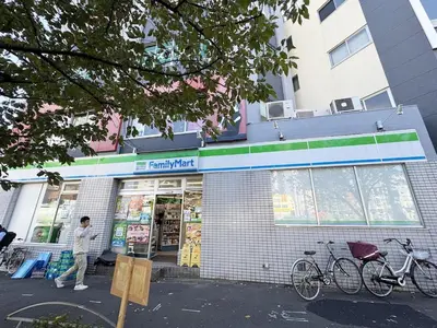 a woman walking in front of a store at 3-mins walk from Hibiya Line station in the Ueno area of Taito city, 2-bed private rental, 8 mins direct to Akihabara, 24 mins to Ginza in Tokyo