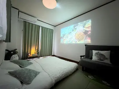 a bedroom with a bed and a large window at IITaito area,3 people,3-minute to station, 2-tatami beds,family type in Tokyo