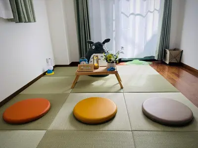 a living room with a dog sitting in the window at IITaito area,3 people,3-minute to station, 2-tatami beds,family type in Tokyo