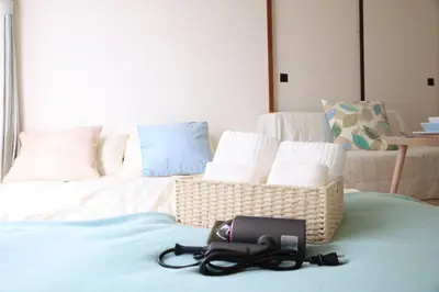 a camera sitting on top of a bed at \u6c60\u888b\u99c5\u5f92\u6b697\u5206 \u5c71\u624b\u7dda\u4ea4\u901a\u4fbf\u5229 \u8a2d\u5099\u5b8c\u5099 in Tokyo