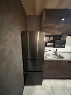 a kitchen with a stainless steel refrigerator and a sink at Luxury modern 3LDK in central Tokyo 5 min to Metro in Tokyo