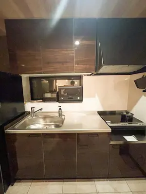 a kitchen with a sink and a microwave at Luxury modern 3LDK in central Tokyo 5 min to Metro in Tokyo