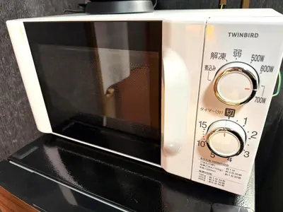 a microwave oven sitting on top of a counter at Yama Hotel Tsukiji in Tokyo